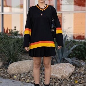 Black Hockey Jersey with Red and Yellow Stripes
